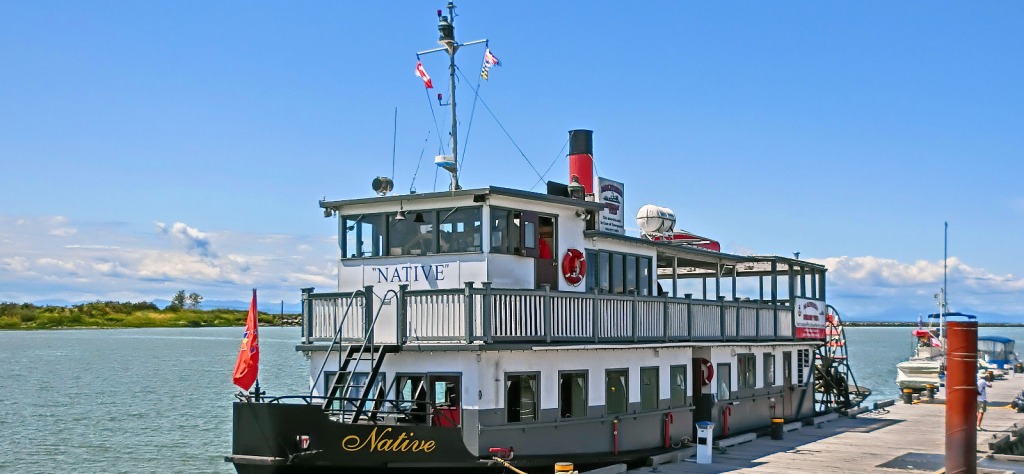 MV Native paddlewheeler docked at the pier on a sunny day