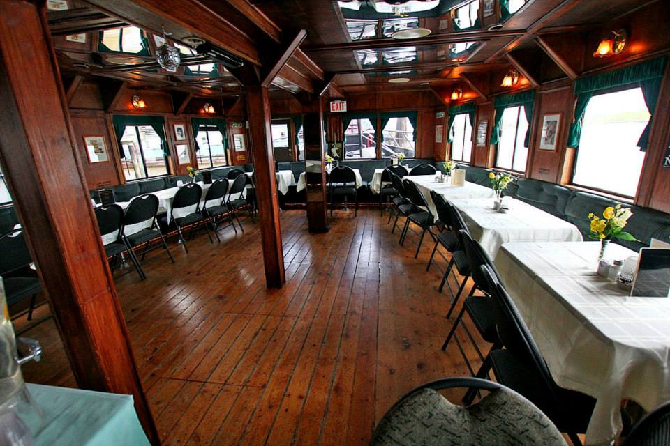 Lower deck dining interior with warm ambient lighting